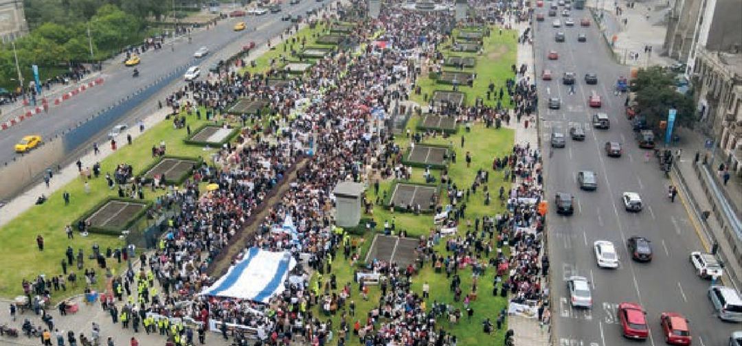 Aerial view of a large March of Life crowd filling a city avenue